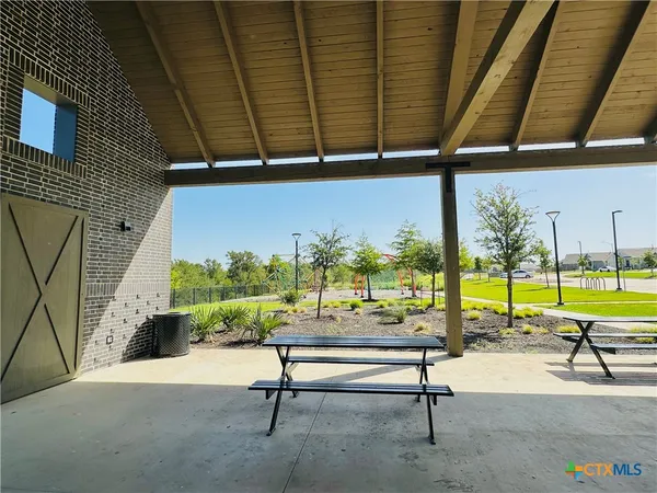 a view of swimming pool with outdoor seating