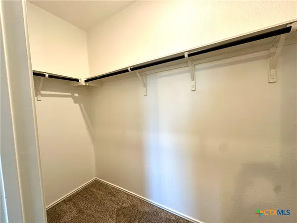 a view of a room with racks on the wall