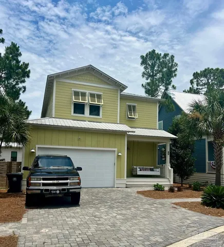 a front view of a house with garage