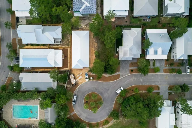 an aerial view of residential house with outdoor space and parking