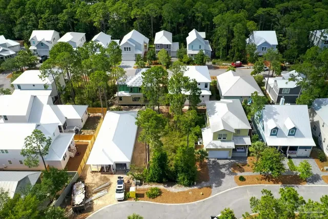 an aerial view of multiple houses with outdoor space