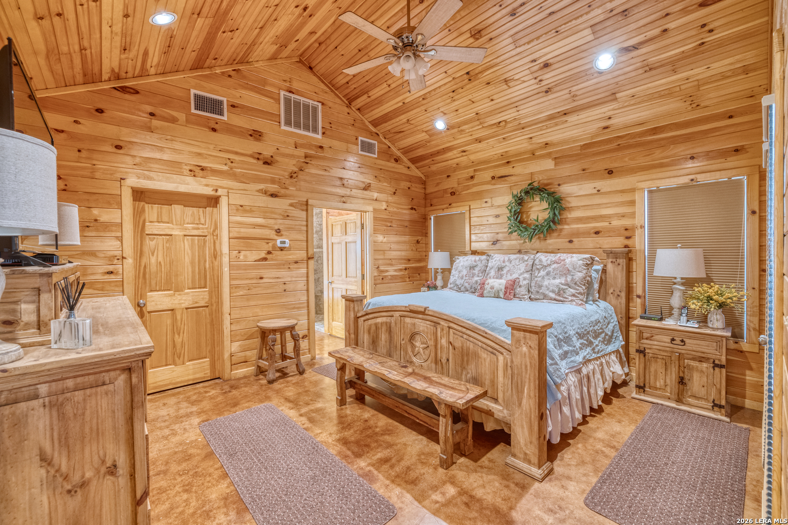 206 South River Pl Road Rio Frio, TX 78879 - Photo 7 of 14 a spacious bedroom with a bed and a table in it