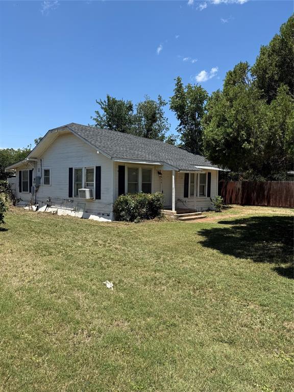 a front view of a house with swimming pool and porch