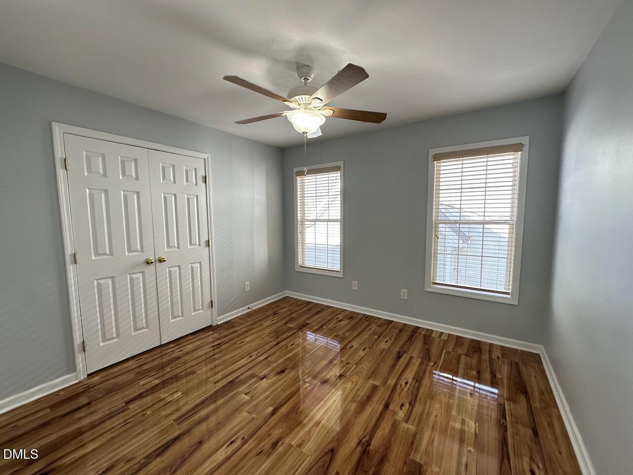2125 Star Sapphire Drive Raleigh, NC 27610 - Photo 19 of 25 a view of an empty room with wooden floor and a window