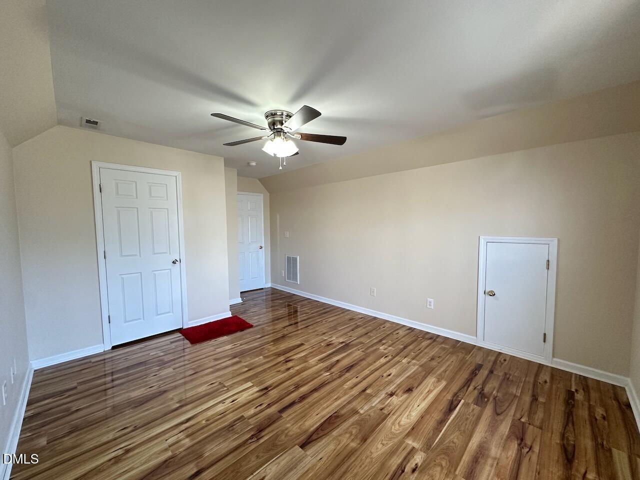 2125 Star Sapphire Drive Raleigh, NC 27610 - Photo 22 of 25 a view of empty room with wooden floor
