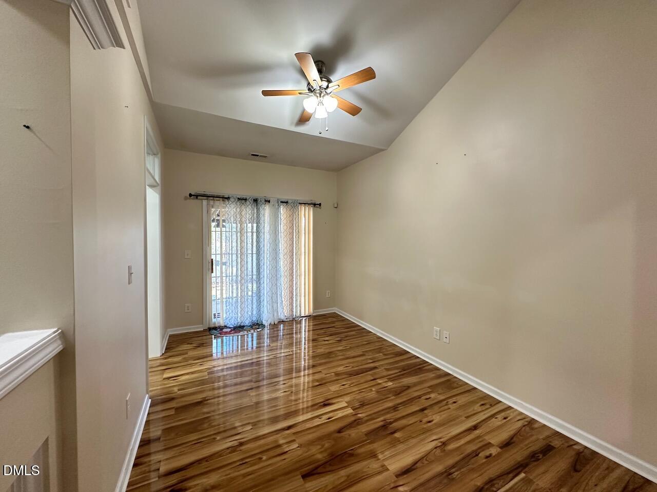 2125 Star Sapphire Drive Raleigh, NC 27610 - Photo 9 of 25 wooden floor in an empty room with a window