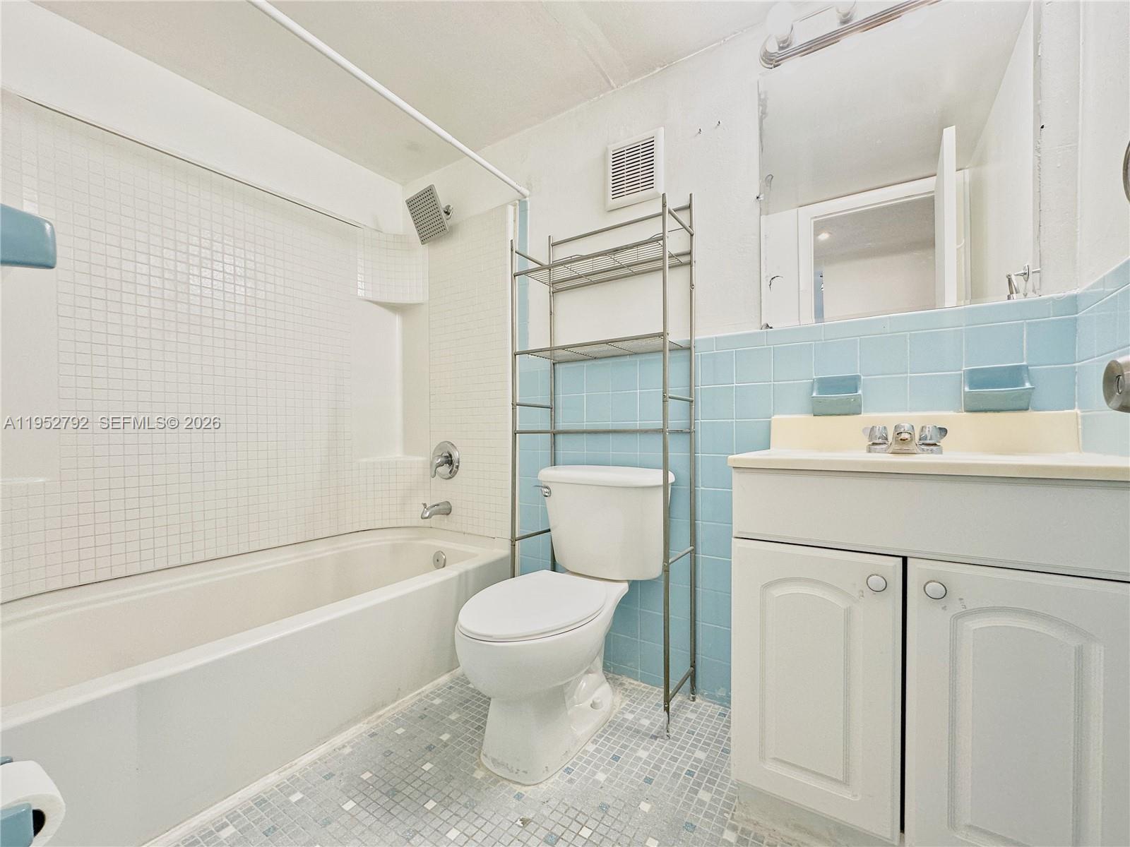 5050 Northwest 7th Street, Unit 705 Miami, FL 33126 - Photo 8 of 12 2nd hallway bathroom