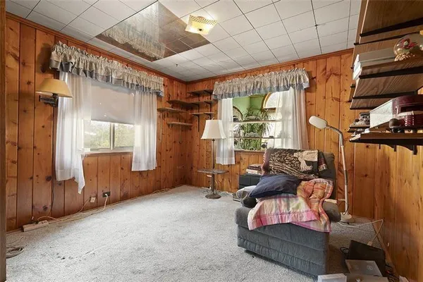 a livingroom with furniture and a window