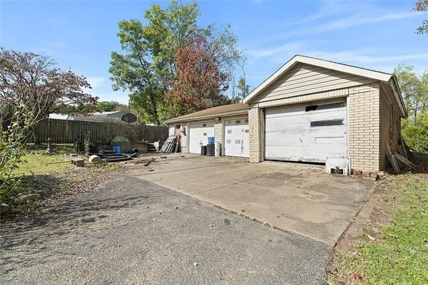 a view of a house with a yard and garage
