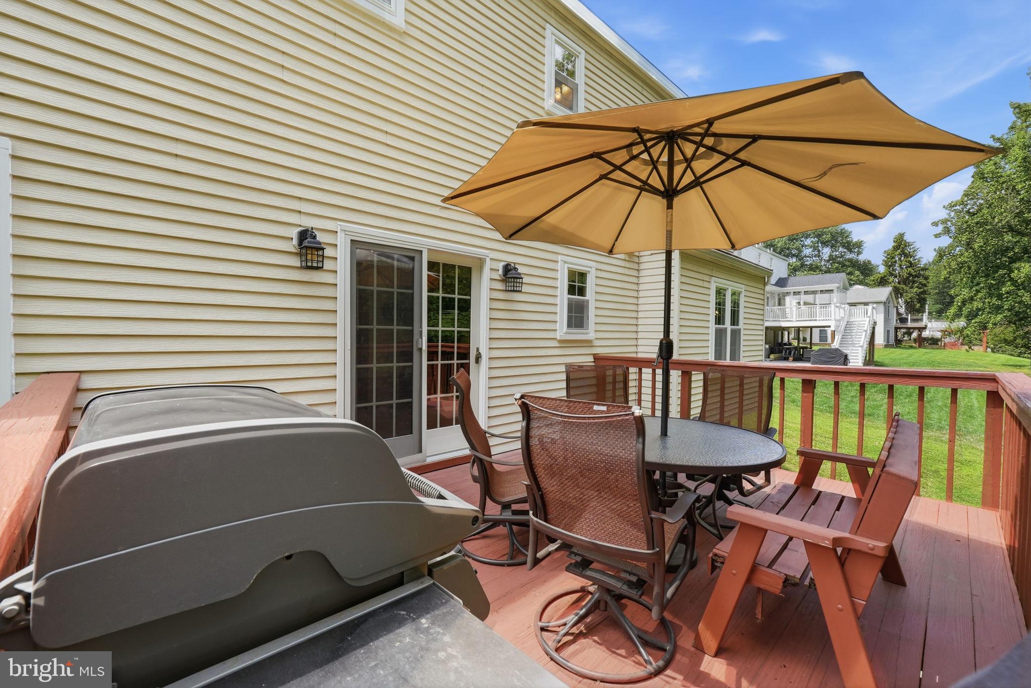 15005 Timberlake Drive Silver Spring, MD 20905 - Photo 6 of 36 Sunny deck with inviting umbrella shade.