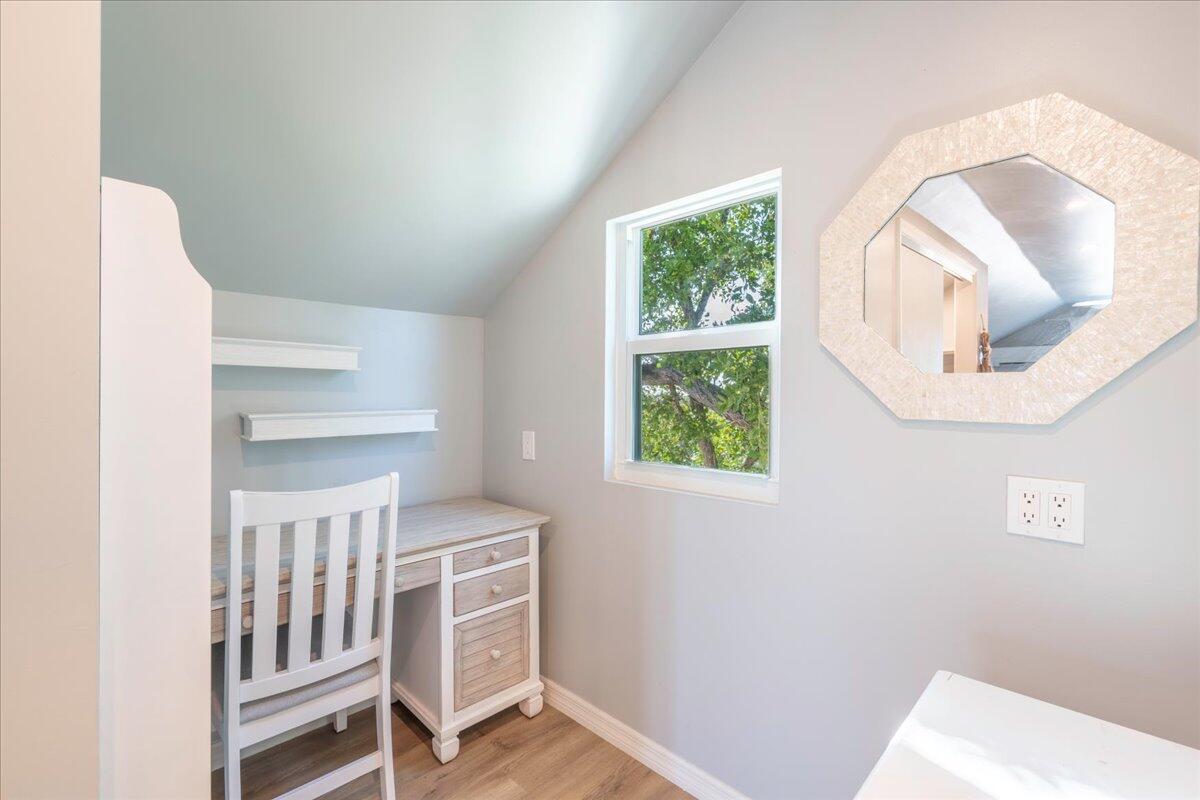 3167 Stewart Road Summerland Key, FL 33042 - Photo 22 of 33 a view of a livingroom with wooden floor and white walls