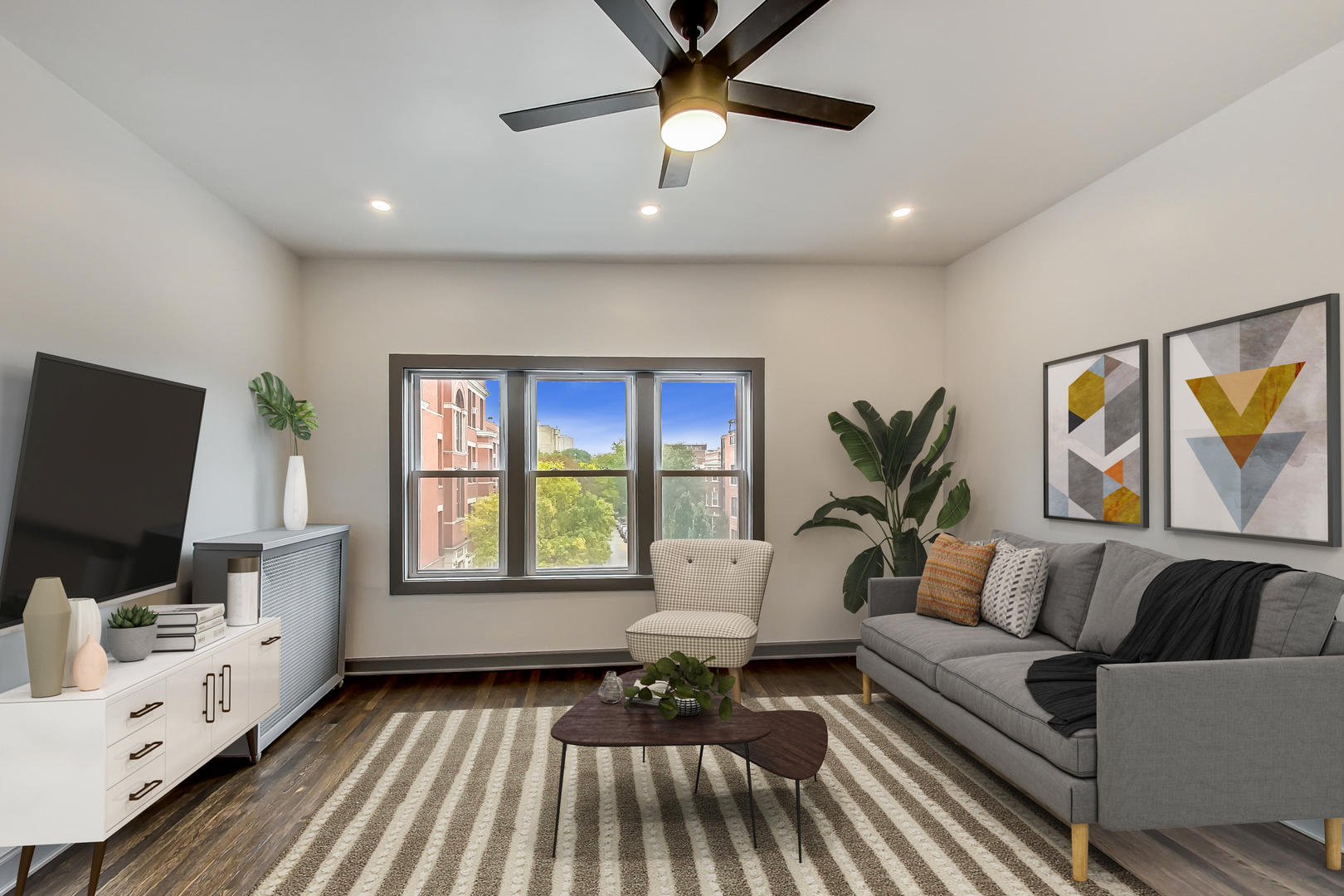 3263 North Broadway, Unit 3 Chicago, IL 60657 - Photo 2 of 37 a living room with furniture and a flat screen tv