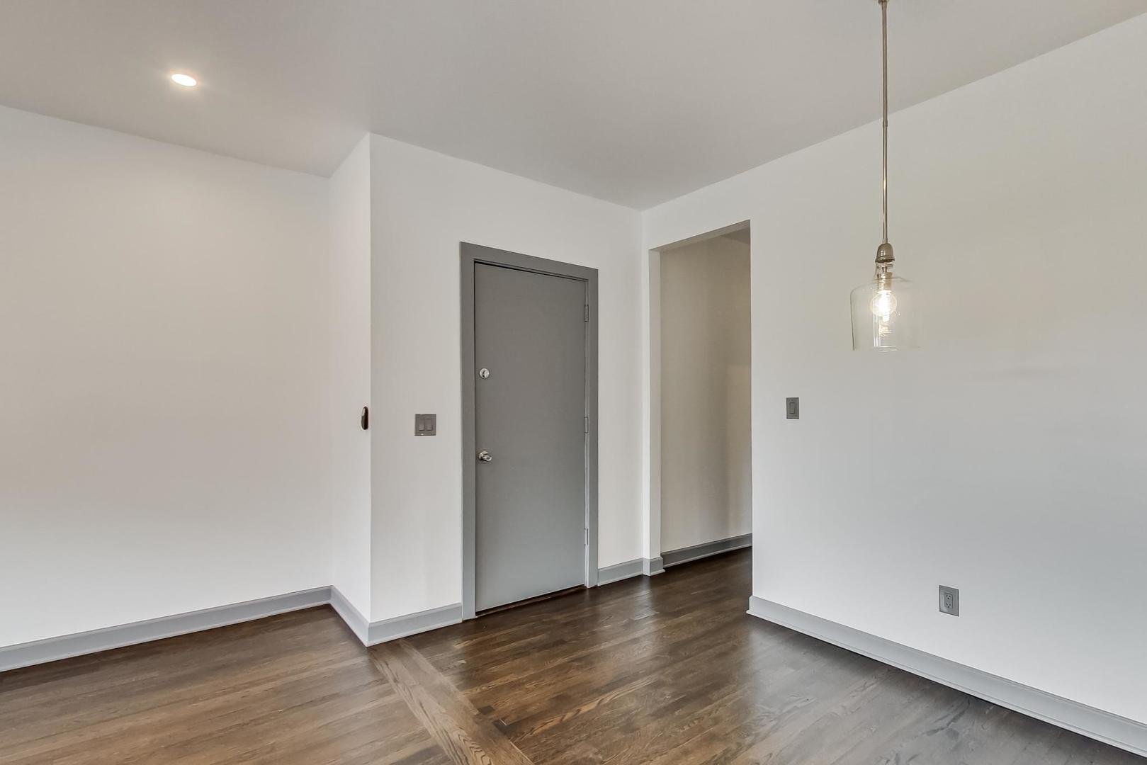 3263 North Broadway, Unit 3 Chicago, IL 60657 - Photo 13 of 37 a view of an empty room with wooden floor and closet