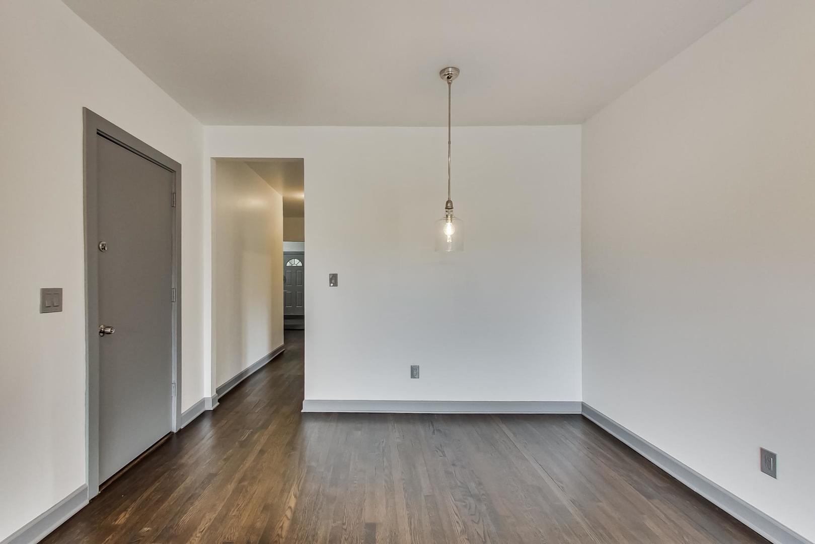 3263 North Broadway, Unit 3 Chicago, IL 60657 - Photo 17 of 37 a view of an empty room with wooden floor and closet