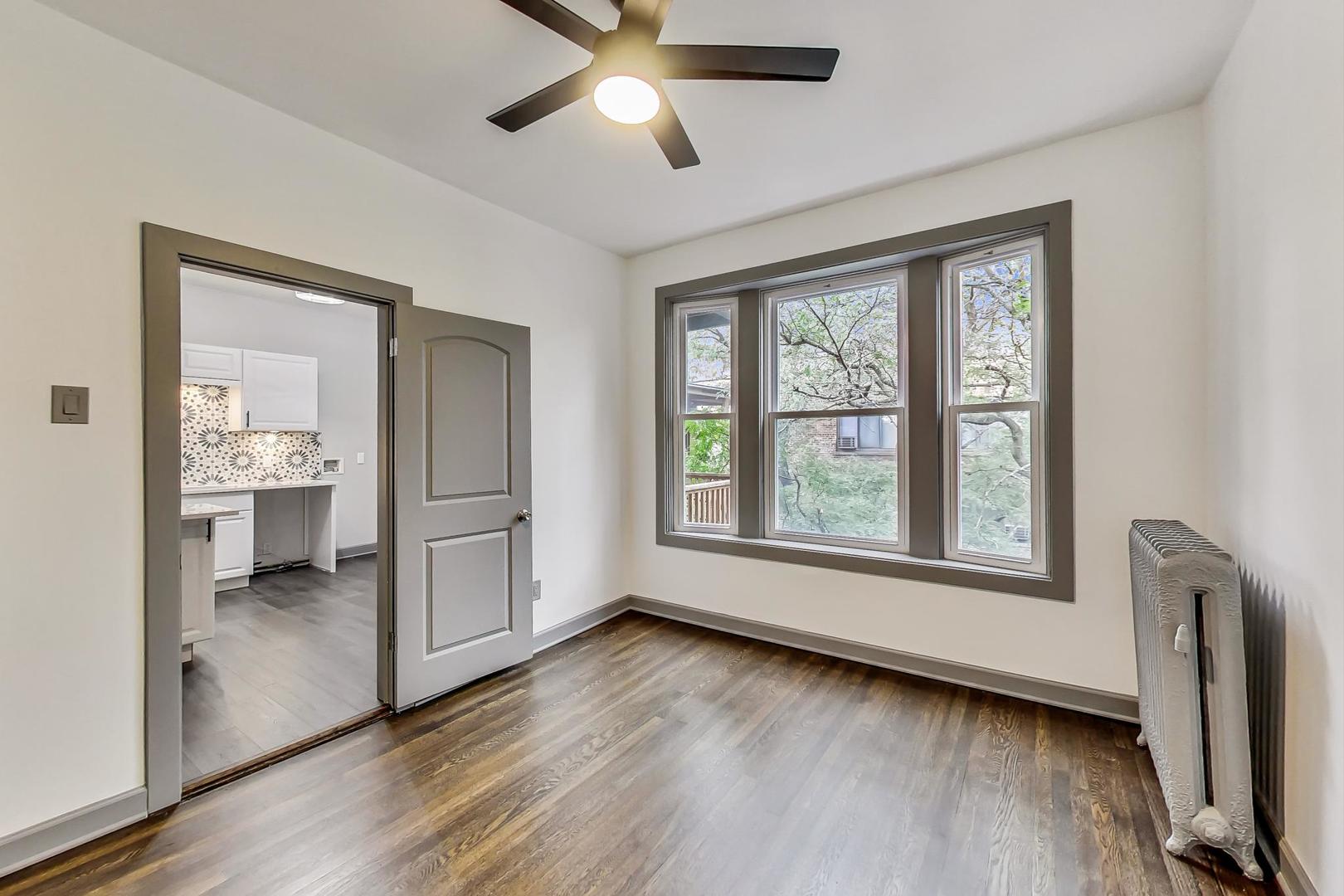 3263 North Broadway, Unit 3 Chicago, IL 60657 - Photo 27 of 37 a view of livingroom with furniture wooden floor and window