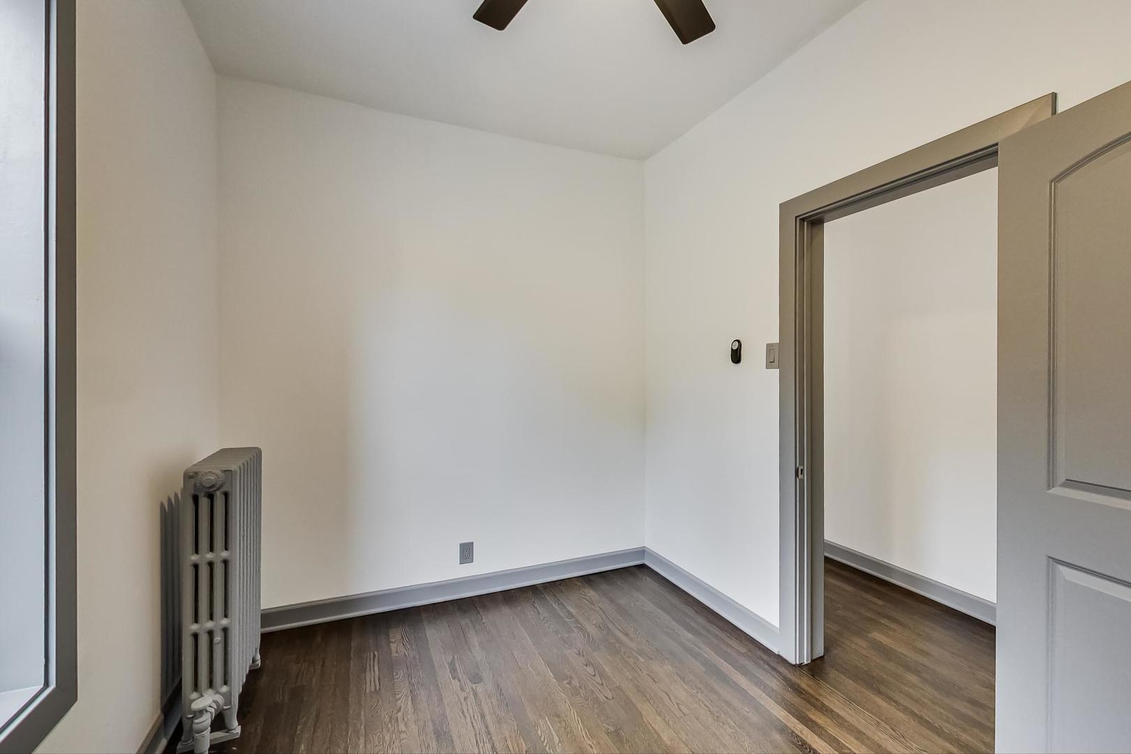 3263 North Broadway, Unit 3 Chicago, IL 60657 - Photo 29 of 37 a view of an empty room and wooden floor