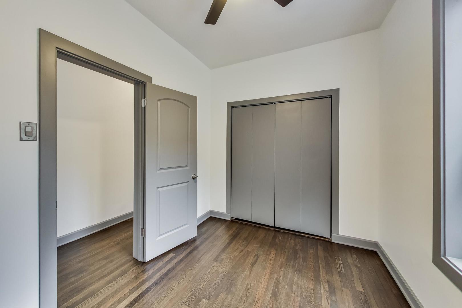 3263 North Broadway, Unit 3 Chicago, IL 60657 - Photo 30 of 37 an empty room with wooden floor and closet