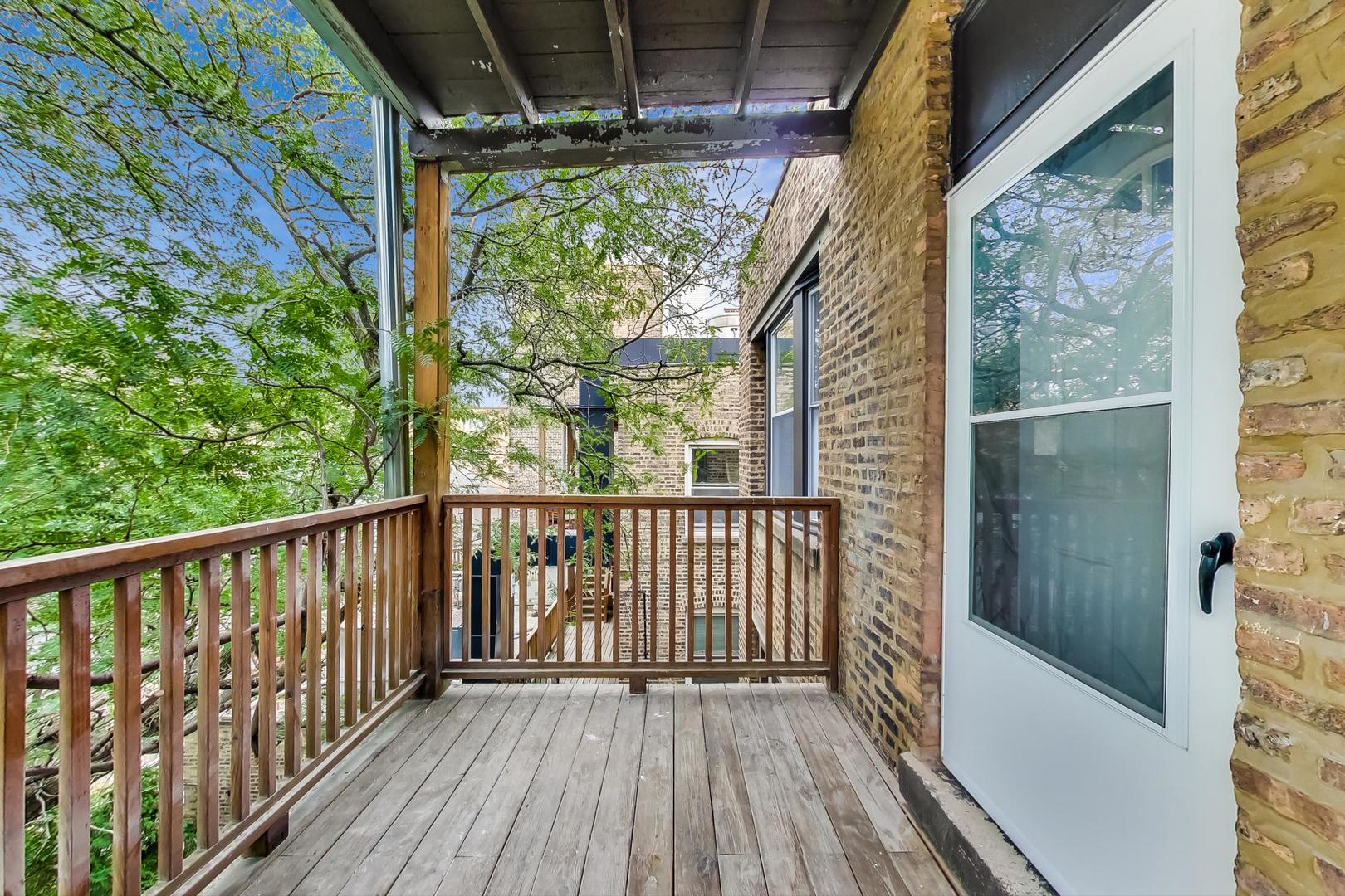 3263 North Broadway, Unit 3 Chicago, IL 60657 - Photo 33 of 37 a view of balcony with wooden floor