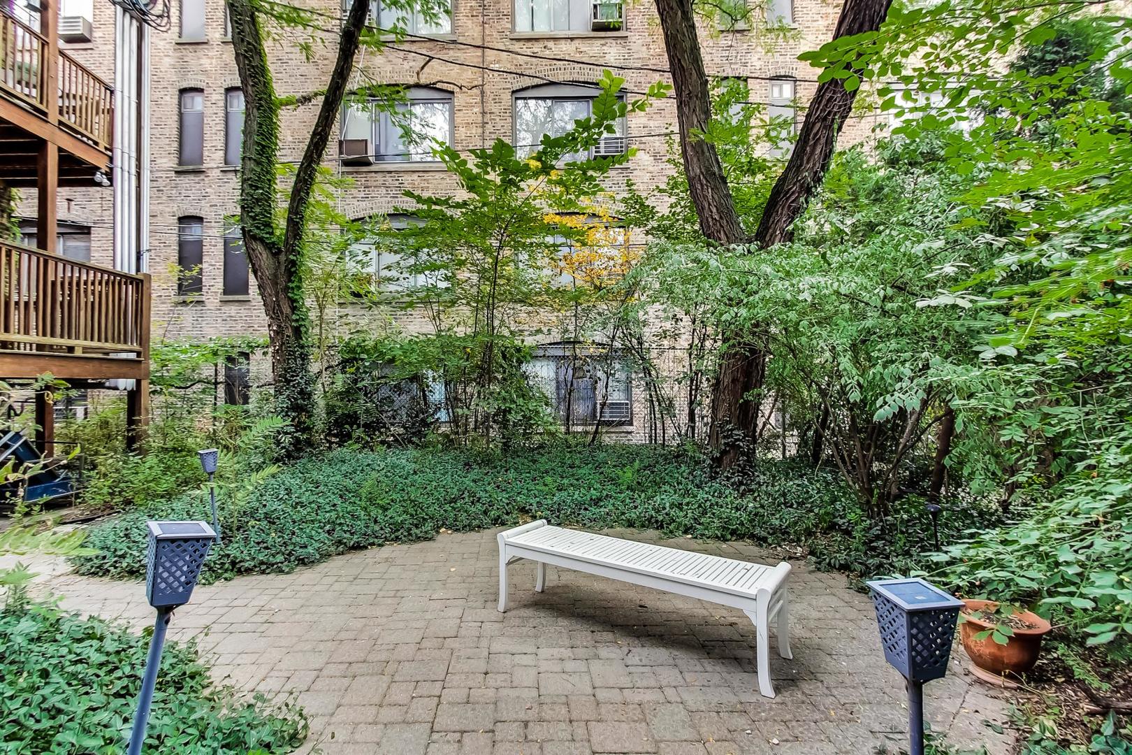 3263 North Broadway, Unit 3 Chicago, IL 60657 - Photo 36 of 37 a view of a backyard with sitting area