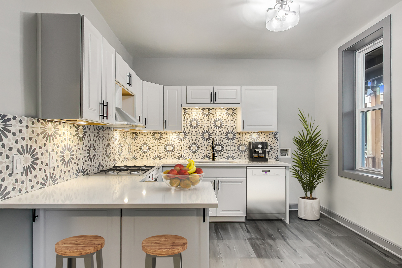 3263 North Broadway, Unit 3 Chicago, IL 60657 - Photo 5 of 37 a kitchen with a sink a refrigerator and wooden floor