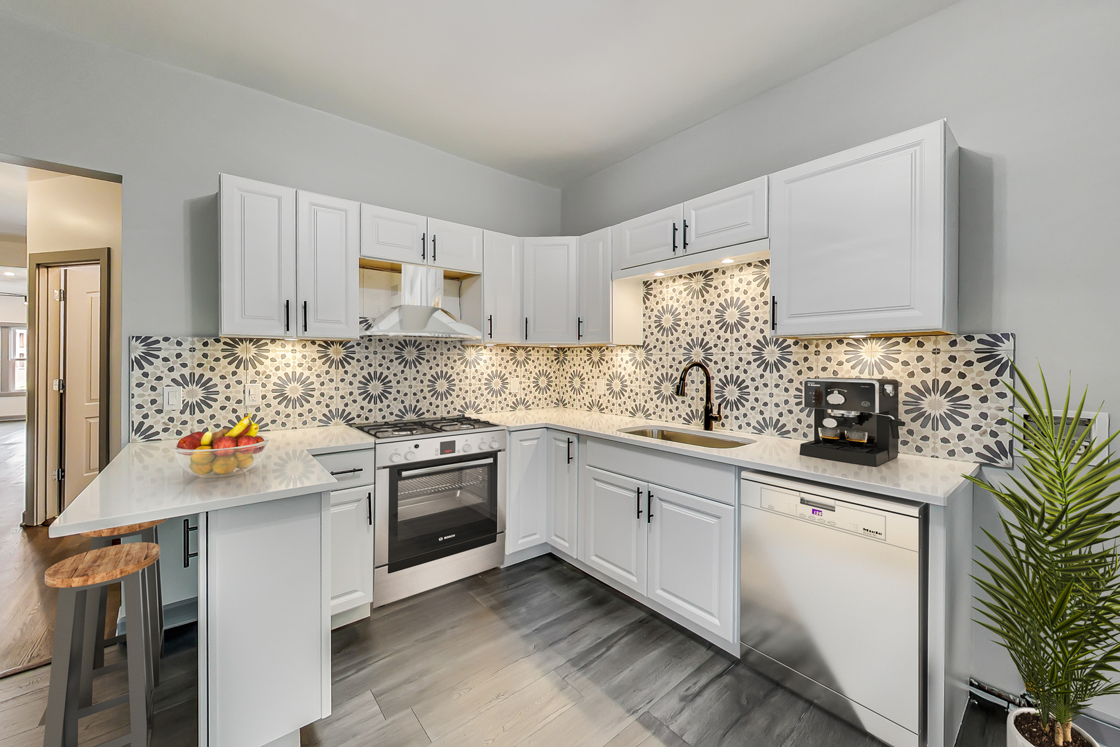 3263 North Broadway, Unit 3 Chicago, IL 60657 - Photo 6 of 37 a kitchen with stainless steel appliances a sink stove and cabinets