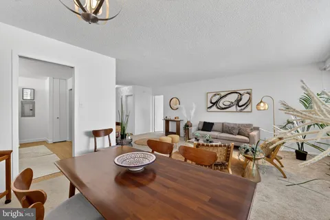 a living room with furniture and a table