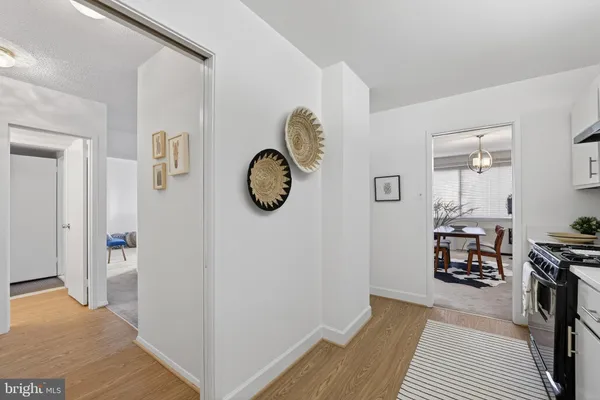 a view of a livingroom with furniture and wooden floor