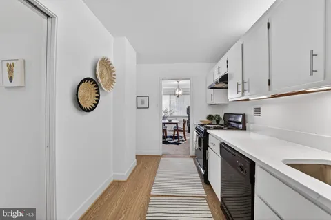 a kitchen with a sink and a refrigerator
