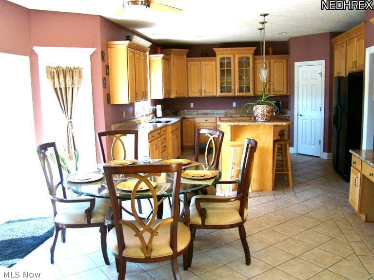 7315 Alexander Road Painesville, OH 44077 - Photo 6 of 18 Breakfast room with Gourmet kitchen has ceramic floor and features two tiered Granite counter tops.