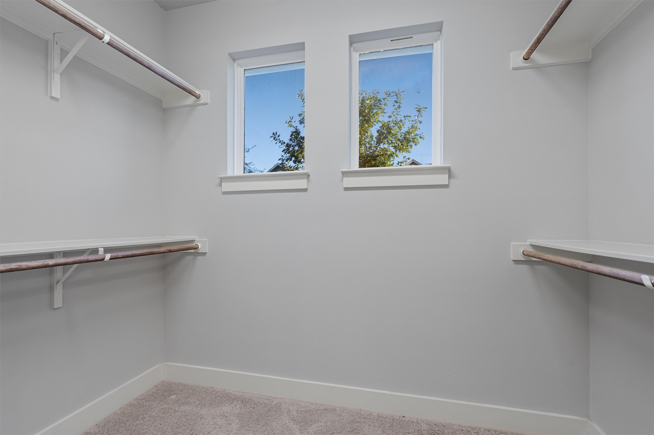 8709 Alderman Dr. Austin, TX 78747 - Photo 22 of 37 Walk in closet with carpet flooring