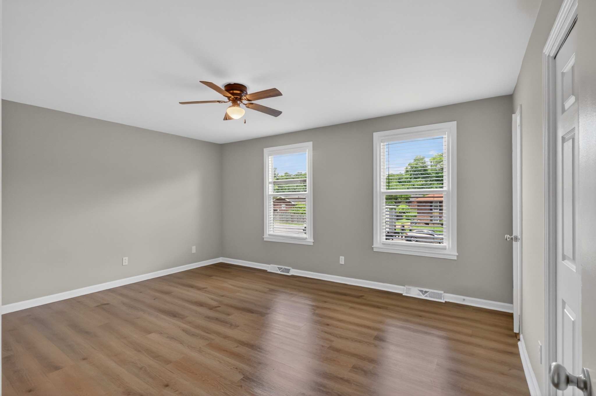 489 Canton Pass Madison, TN 37115 - Photo 8 of 25 an empty room with wooden floor and windows
