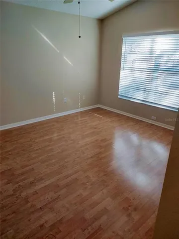 a view of an empty room with a window