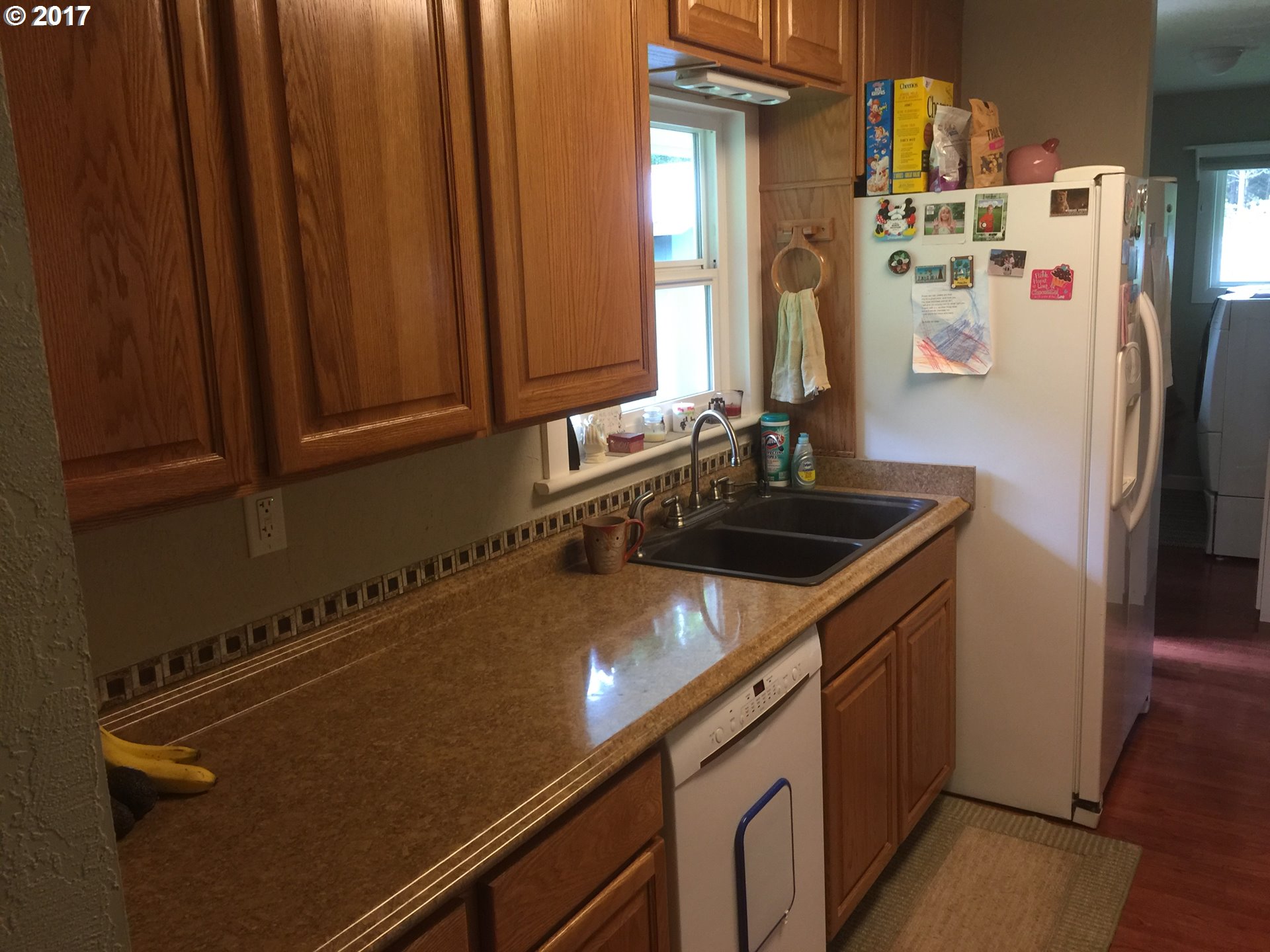 72227 Rouse Road North Cottage Grove, OR 97424 - Photo 15 of 24 a view of a kitchen with a sink and cabinets