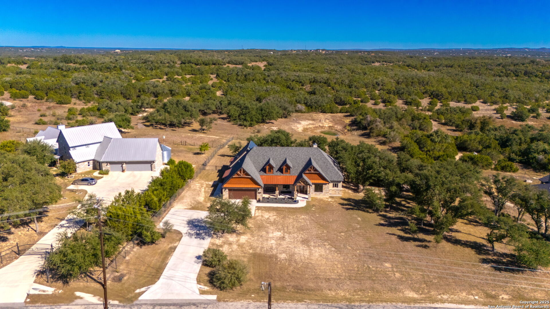an aerial view of residential houses with outdoor space