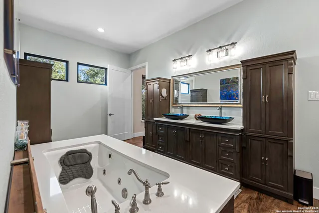 a kitchen with a refrigerator and a sink