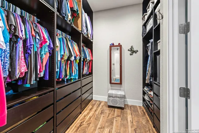 a kitchen with stainless steel appliances a sink and a refrigerator