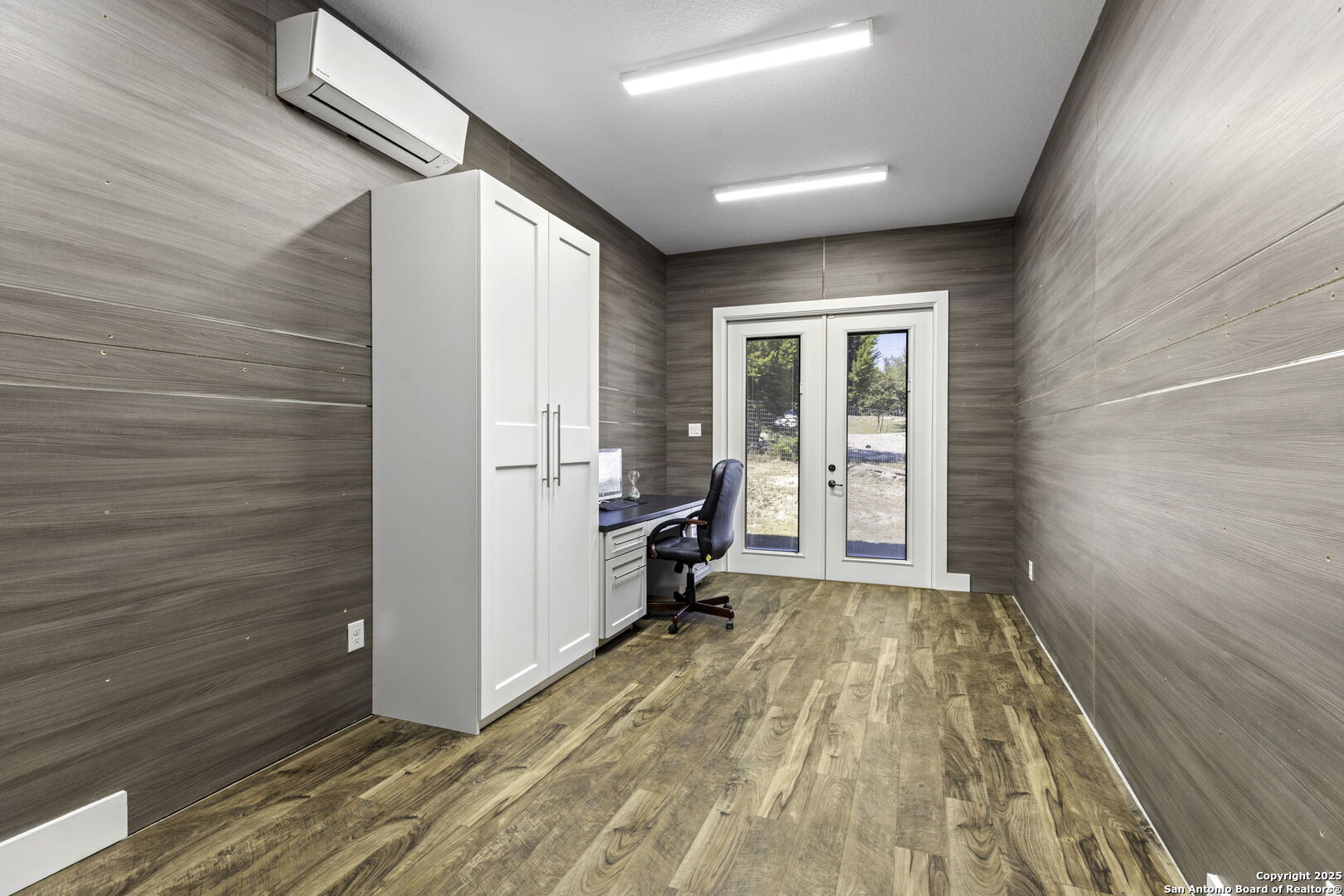 1119 Sunrise Place Spring Branch, TX 78070 - Photo 20 of 53 a view of a bedroom with wooden floor and a window