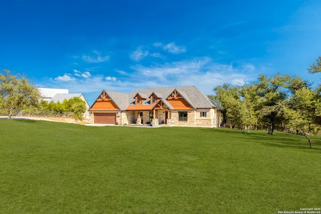 a view of a big house with a big yard