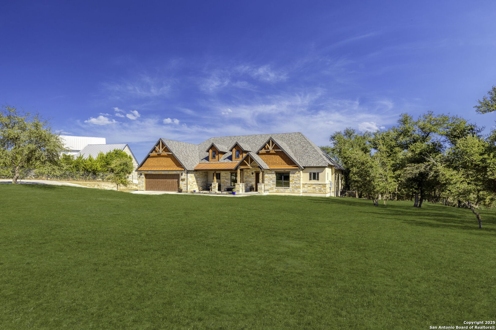 1119 Sunrise Place Spring Branch, TX 78070 - Photo 2 of 53 a view of a big house with a big yard
