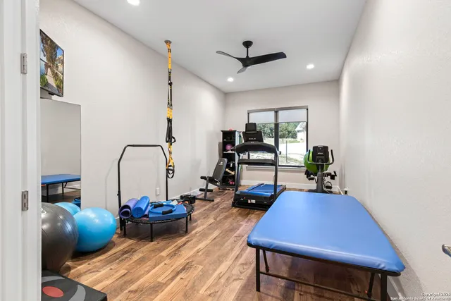 a kitchen with stainless steel appliances granite countertop a refrigerator a stove and a sink