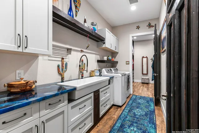 a living room with furniture a rug and a book shelf