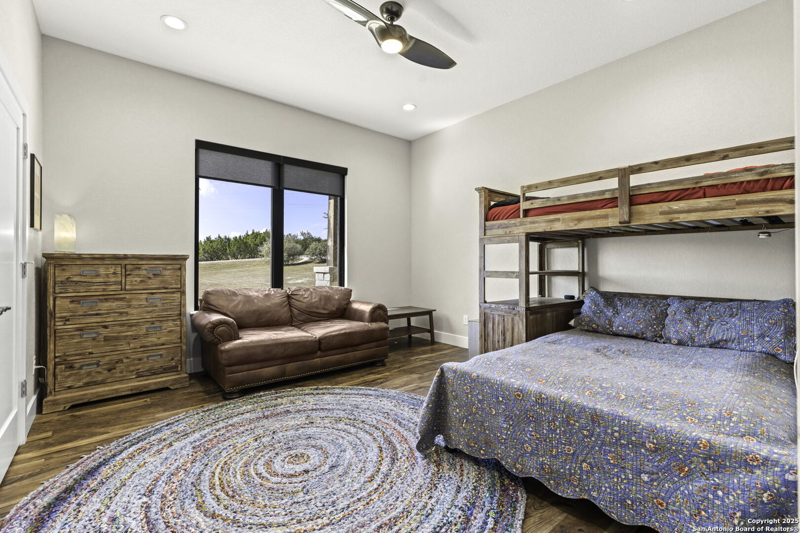 1119 Sunrise Place Spring Branch, TX 78070 - Photo 25 of 53 a bedroom with a bed and a couch