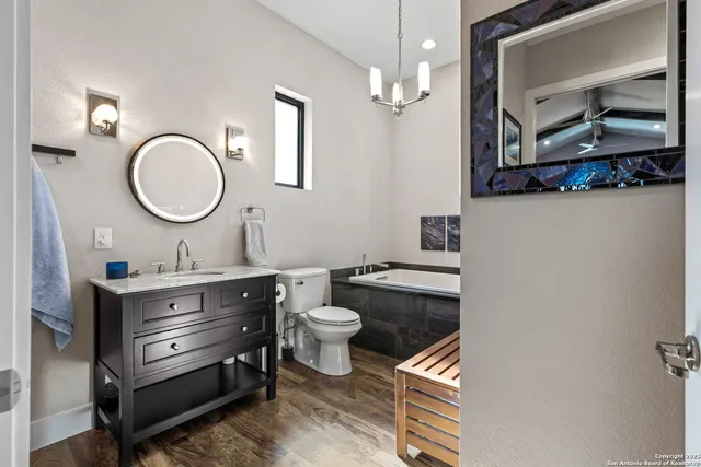 a bathroom with a glass shower door