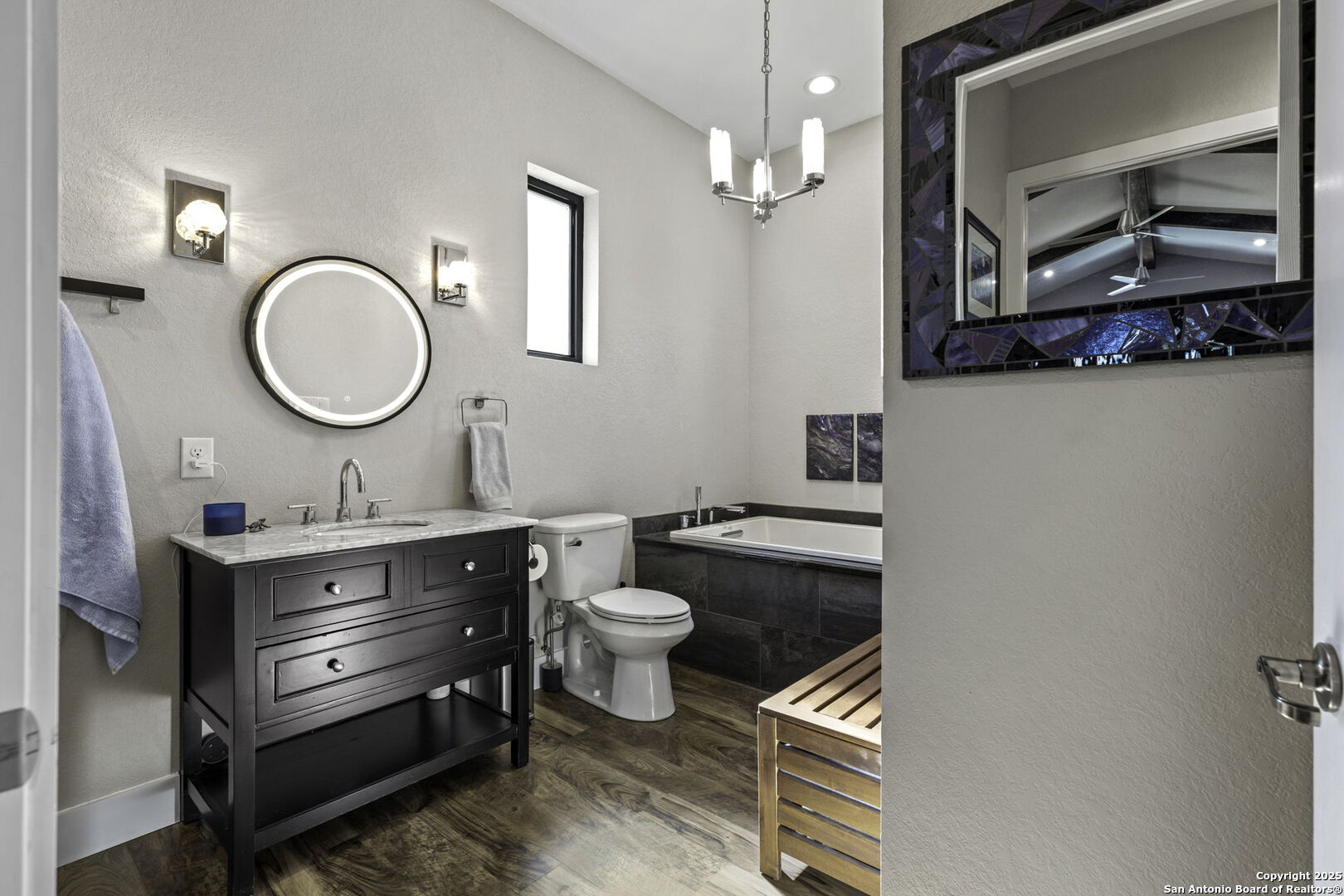 1119 Sunrise Place Spring Branch, TX 78070 - Photo 27 of 53 a bathroom with a toilet a sink and a mirror