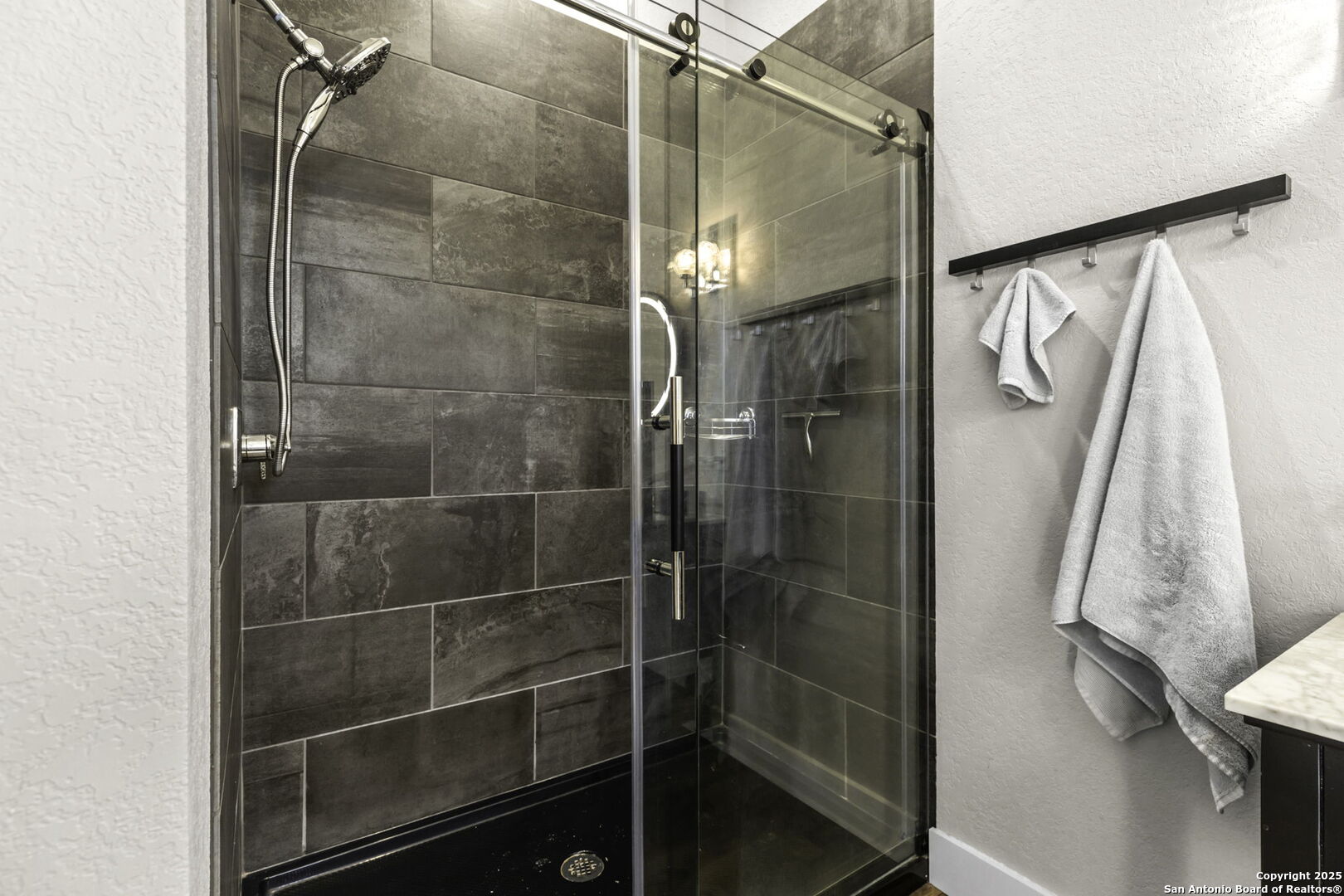 1119 Sunrise Place Spring Branch, TX 78070 - Photo 28 of 53 a bathroom with a glass shower door