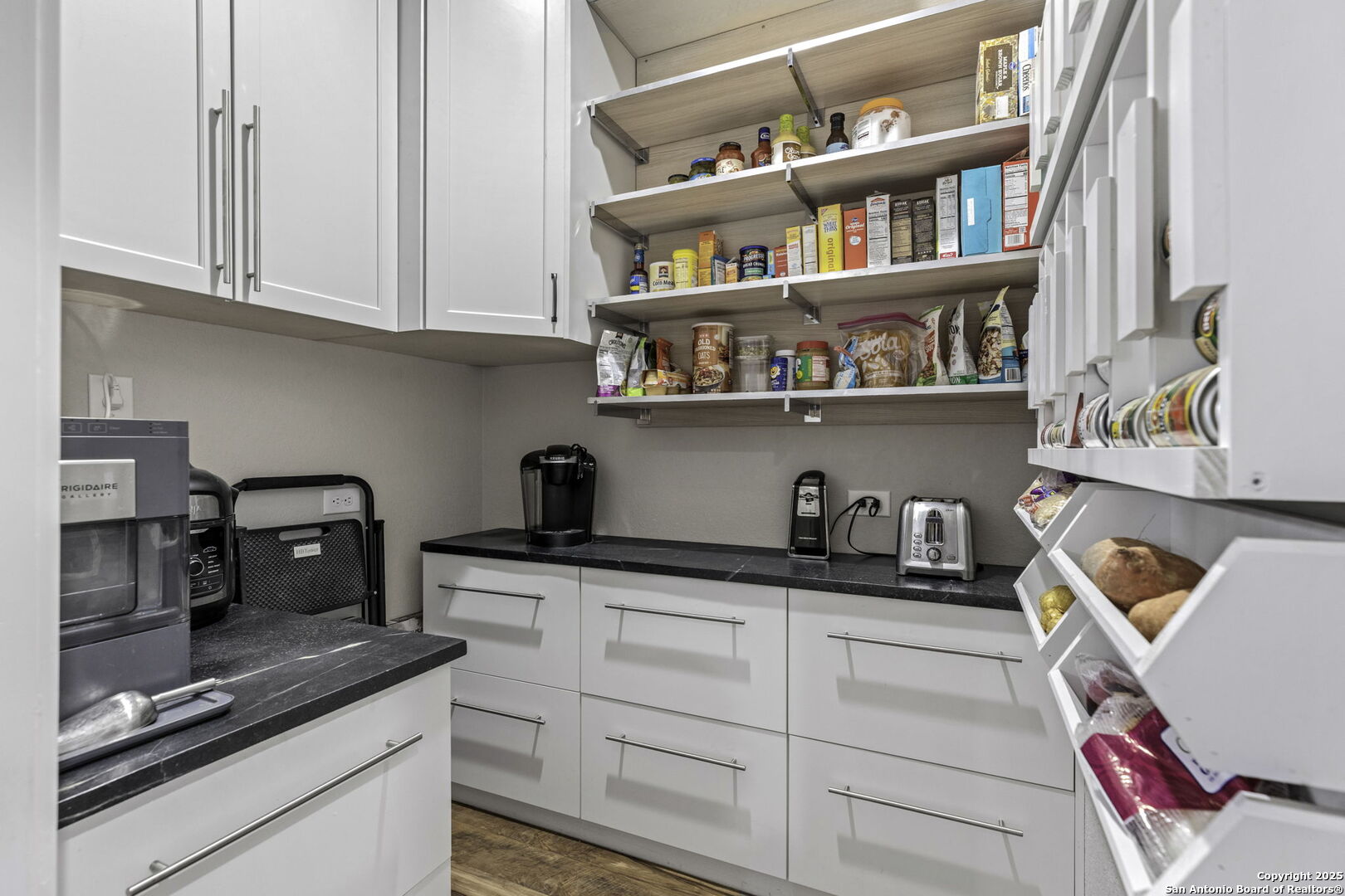 1119 Sunrise Place Spring Branch, TX 78070 - Photo 31 of 53 a kitchen with cabinets and a wooden floor