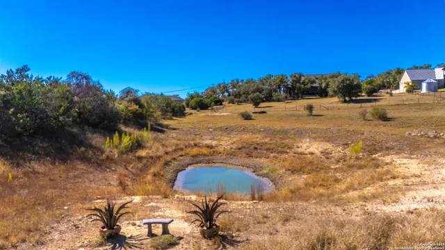 a view of a big yard with an outdoor space and seating