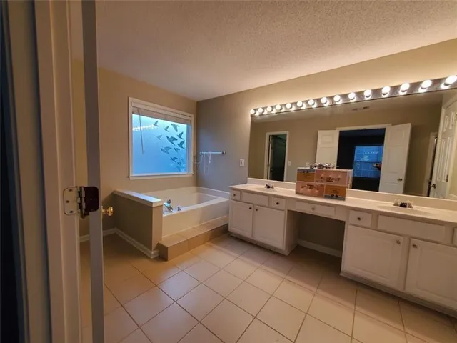 a room with a mirror and a sink