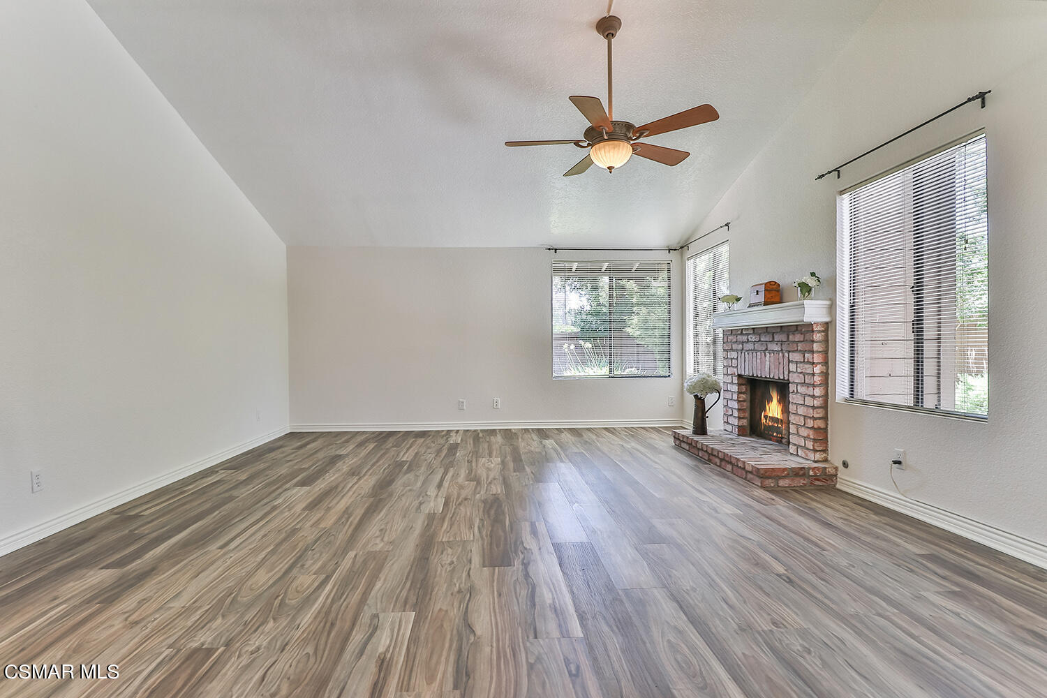 2068 Emory Avenue Simi Valley, CA 93063 - Photo 11 of 35 a view of empty room with fireplace and wooden floor