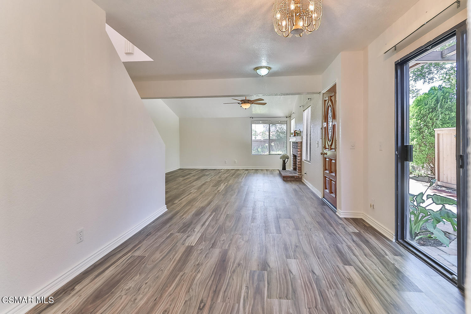 2068 Emory Avenue Simi Valley, CA 93063 - Photo 14 of 35 a view of hallway with wooden floor and chandelier